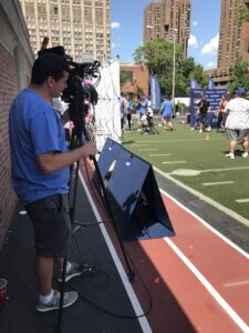 video production crew filming a sports event