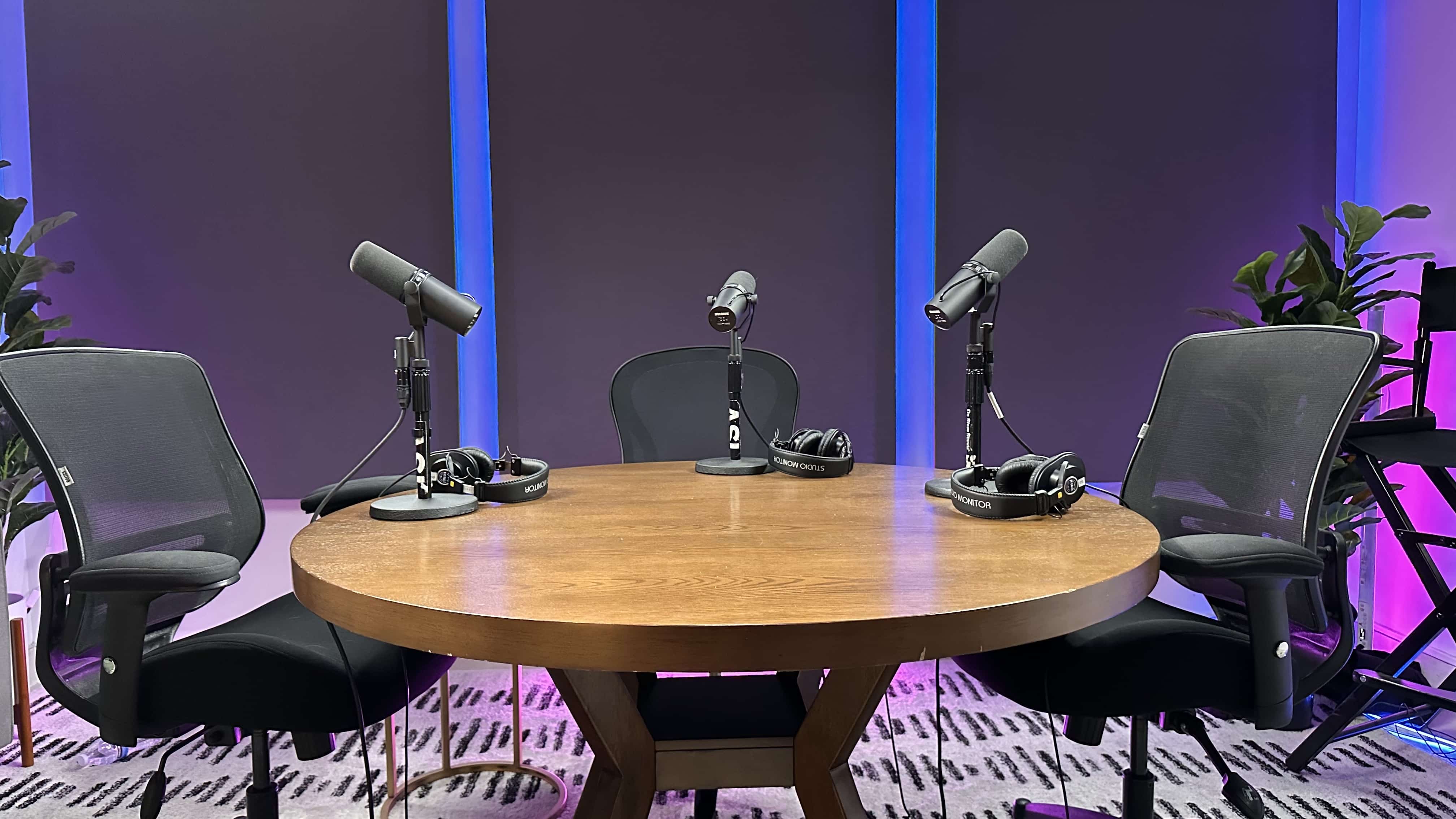 blue lights at video podcast studio with three shure sm7b mics