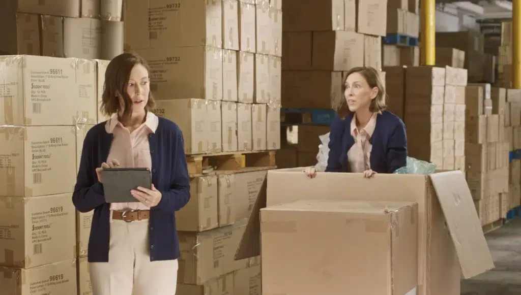 The same women surprising herself by popping out of a box during a new jersey video production in newark