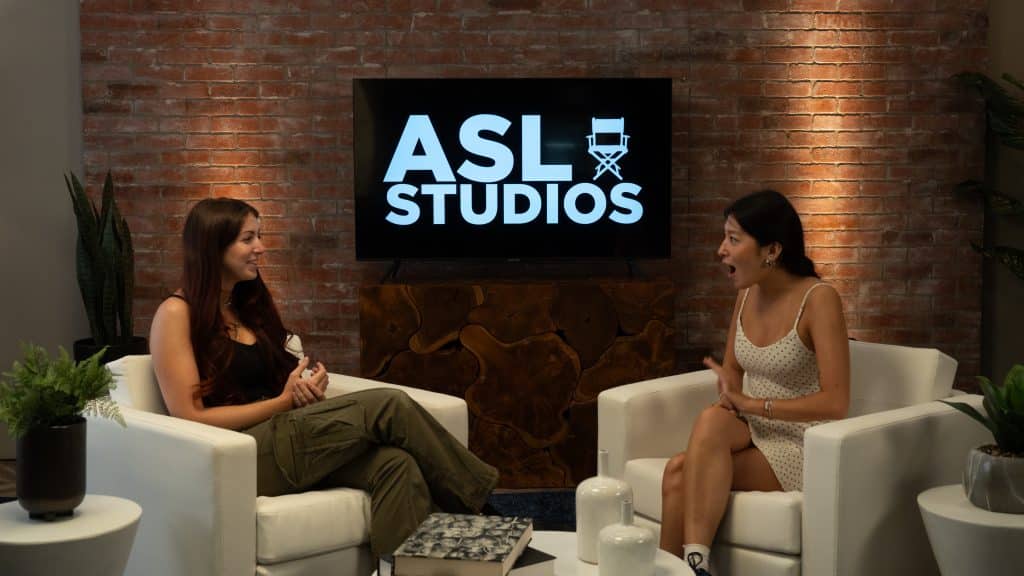 Two guests at asl studios living room set