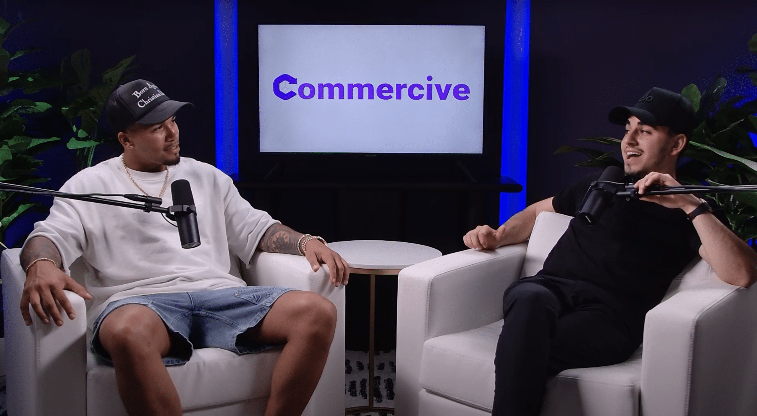 guest and host at podcast studio in nyc with blue background